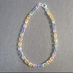 B152   8.69ctw  multicolor natural sapphire tennis bracelet.  Size 725.Rh